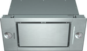 Stainless steel kitchen range hood with round control knobs on either side and a brushed metal finish (Miele).