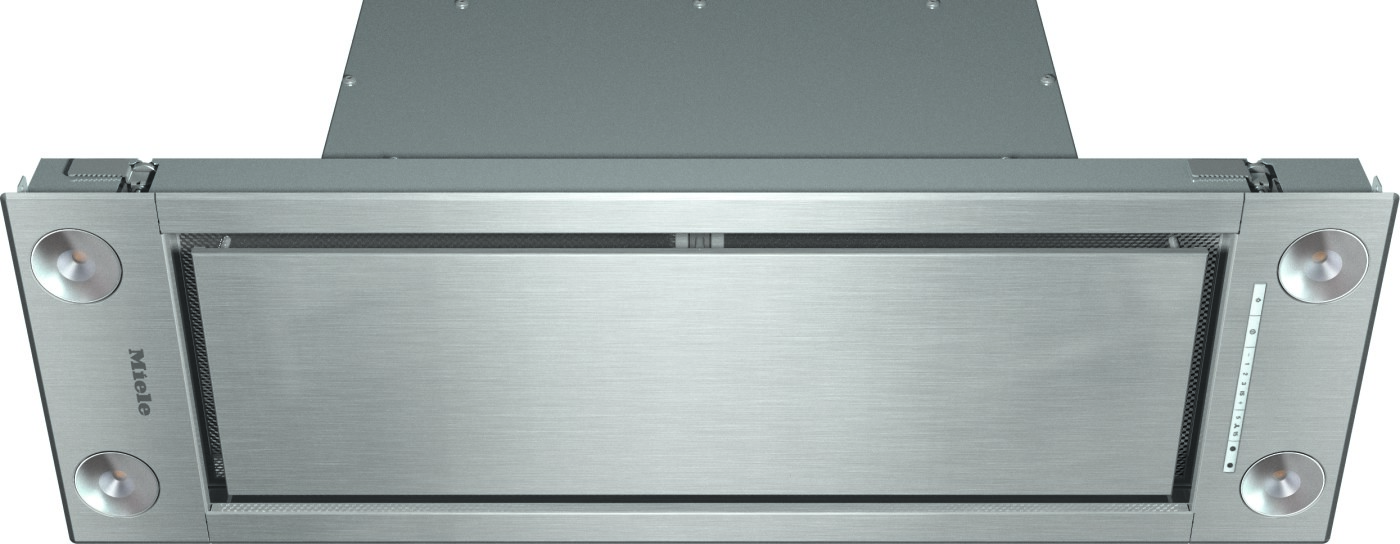 Brushed stainless steel kitchen range hood with two round side lights and Miele branding, viewed front-on.