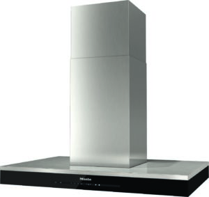 Stainless steel chimney-style kitchen range hood mounted above a cooktop, with a black base featuring the Miele logo and touch controls.