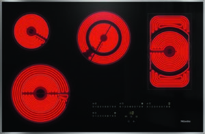 Glass-ceramic electric cooktop with four red-hot coil burners and a digital control panel (Miele)