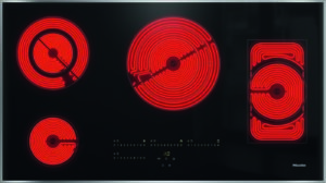 Electric cooktop with four red glowing heating elements on a black glass surface; Miele logo visible.
