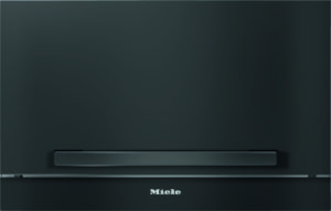 Sleek, matte black Miele built-in appliance front panel with a slim horizontal handle.