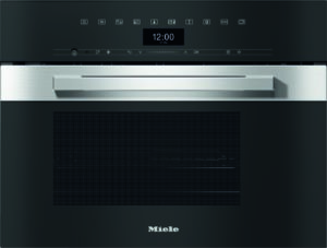 Built-in black oven with a stainless steel handle and a digital clock showing 12:00 above the door.
