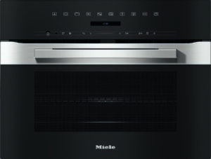 Built-in Miele oven with a stainless steel handle, black control panel, and digital display above a large glass door with a textured interior grille design.