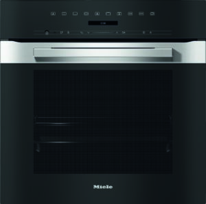 Miele stainless steel built‑in oven front with black control panel and integrated display; metal handle visible at center top.