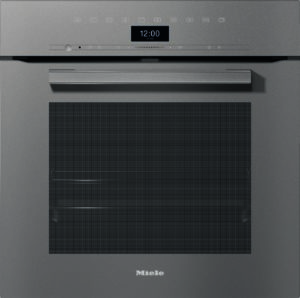 Front view of a Miele built-in stainless steel oven with a digital clock and control strip along the top surface.