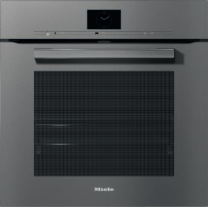 Front view of a Miele stainless steel built-in oven with a circular clock display at the top center and a long handle above the door.