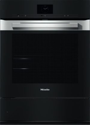 Black Miele oven with a wide stainless steel handle, digital clock display, and a bottom storage drawer visible beneath the door.