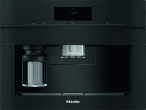 Miele espresso machine with a metal portafilter and glass carafe on the left, clock display on the top panel.