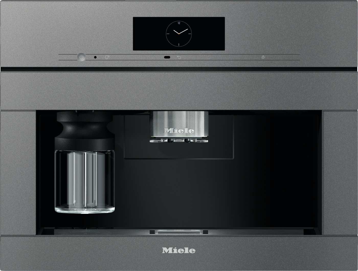 Built-in Miele coffee machine with a glass carafe on the left and a stainless espresso spout in the center.