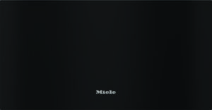 Close-up of a black appliance front with the silver Miele logo centered near the bottom of the panel.