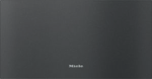 Dark gray textured surface with the Miele logo centered near the bottom edge.