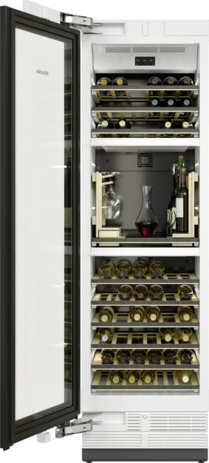 Open wine fridge displaying multiple bottle racks with bottles and a glass decanter on the middle shelf