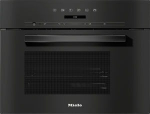 Front view of a black Miele built‑in oven with a horizontal handle and digital clock reading 12:00.