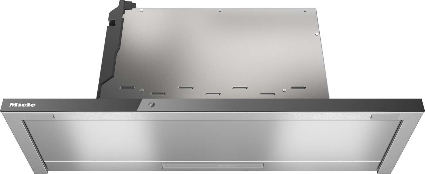 Stainless steel Miele kitchen range hood, front view showing brushed metal finish and vent slot.