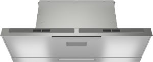 Front view of a stainless steel kitchen range hood with vent slot and control panels on the sides of the top edge