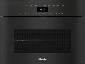 Front view of a black Miele built-in oven with a digital clock showing 12:00 and a vented panel below the control strip