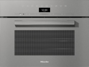 Miele built-in stainless steel oven front with a long horizontal handle and a digital clock showing 12:00 in the center