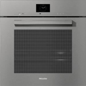 Built-in stainless steel oven front with a digital clock display, slim controls, and a large glass door window.