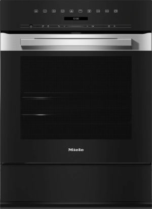 Black Miele oven with stainless steel handle and touch control panel on top, inset into cabinetry