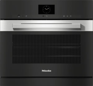 Front view of a black Miele oven with a large stainless steel handle and a central clock display on the upper panel.
