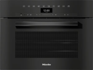 Front view of a black Miele oven with a long horizontal handle, a digital clock showing 12:00, and a row of control icons above.