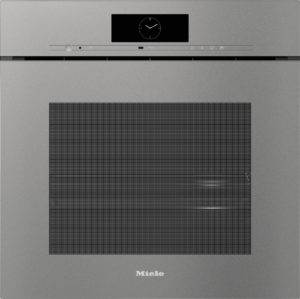 Front view of a Miele built-in oven with a digital clock display and slim control panel above the door