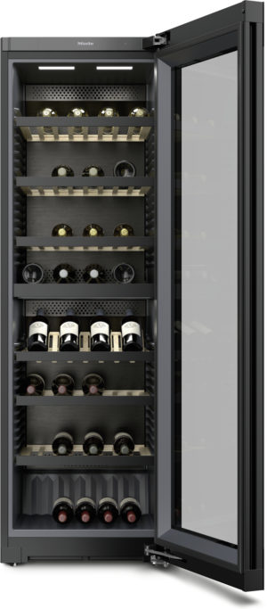 Open wine refrigerator with multiple shelves holding wine bottles behind a glass door, showing interior lighting and racks.
