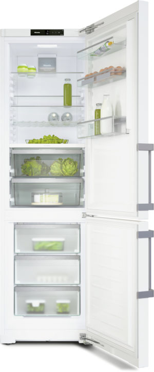 White tall refrigerator with upper fridge and lower freezer, doors open showing vegetables, dairy, and beverages inside