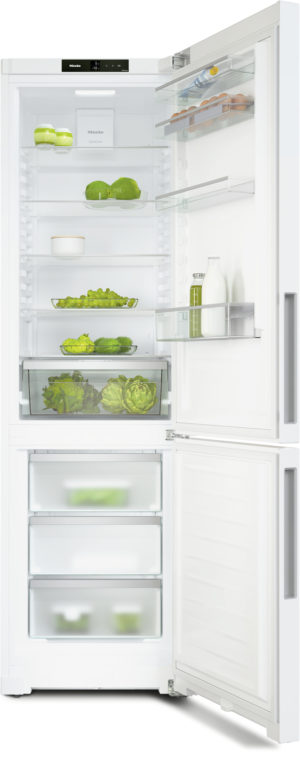 Open white refrigerator with shelves of green vegetables, bottles, and a dairy cart, showing organized storage inside.
