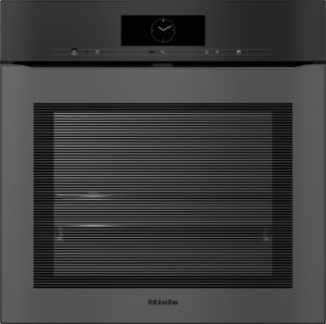 Front view of a Miele built-in oven with a digital clock on the control panel and a striped glass door.