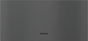 Gray textured appliance panel with the Miele logo centered near the bottom.