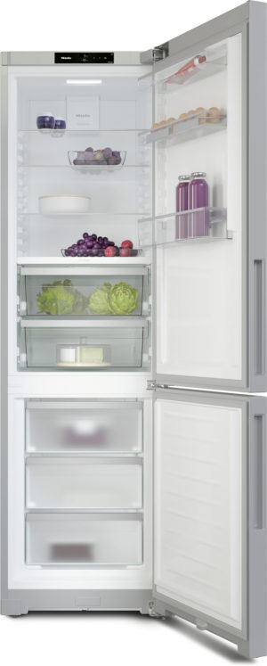 Tall side-by-side refrigerator with bottom freezer, right door open, shelves holding eggs, juice bottles, artichokes, lettuce, grapes, and other groceries.