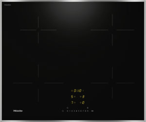 Glossy black induction cooktop with faint zoning guides, a central yellow digital timer, and Miele logo at bottom left.