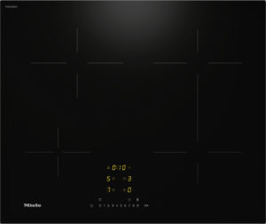 Miele induction cooktop with a black glass surface and subtle zone markings, plus a yellow digital timer display near the bottom center.
