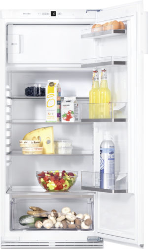Open white refrigerator with shelves holding eggs, juice, cheese, salad, mushrooms, and bottled beverages; fresh produce visible on lower drawer and fruit bowl on middle shelf.