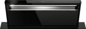 Sleek black Miele wall-mounted range hood with a glossy finish, touch controls on the top edge and built-in LED light.