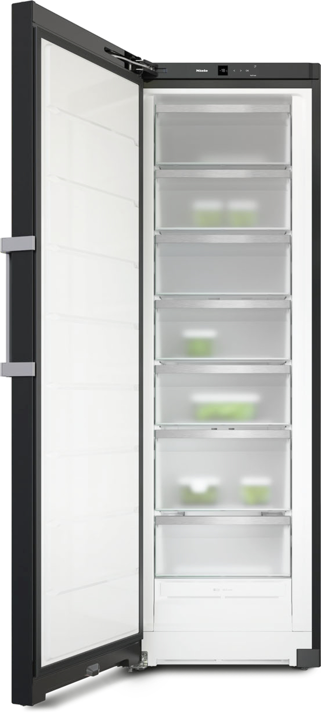 Tall upright freezer with door open, revealing multiple transparent pull-out drawers and bright interior lighting, with a few green containers inside.