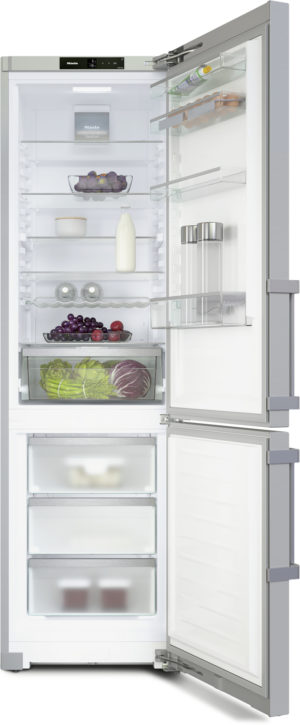 Open tall refrigerator with dairy, produce, and beverages on shelves and in crisper drawers; fruits and vegetables visible inside.