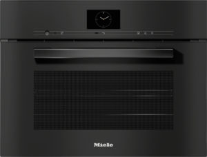 Black Miele built-in oven front with a wide horizontal handle and a centered clock display on the control panel