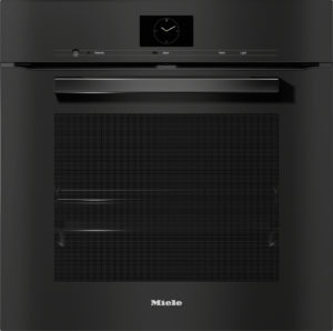 Front view of a black Miele built-in dishwasher with a slim control panel and circular clock display at the top.