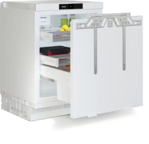 White Miele refrigerator with its door open, showing shelves, drawers, and items inside (lemons and bottles).