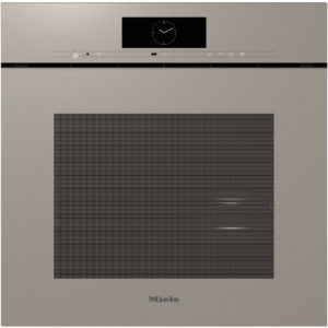 Built-in Miele oven with a large black window on the door, beige metallic finish, and a control strip above featuring a clock display.