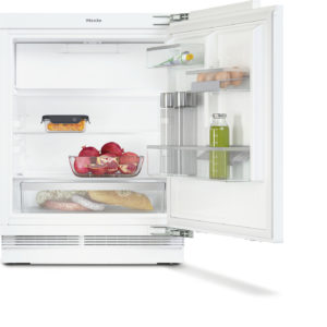Open white refrigerator with eggs, juice, pomegranate, bread, and sausage on shelves and a small container of carrots in the door