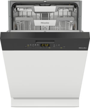 Front view of a Miele dishwasher with the door open and interior racks visible