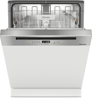 Open Miele dishwasher with upper and lower racks visible inside and stainless steel door panel