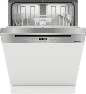 Open Miele dishwasher with empty stainless interior and front control panel visible