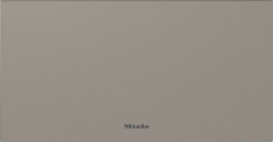 Brown textured surface with the Miele logo centered near the bottom.