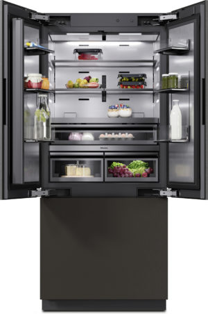 Open, modern black refrigerator stocked with fruits, vegetables, dairy, eggs, jars, and beverages on multiple shelves.