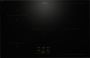 Miele induction cooktop on black glass with outlined cooking zones and amber digital controls at the lower center